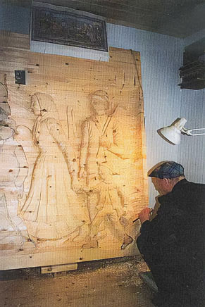 Per Einbu carving the relief