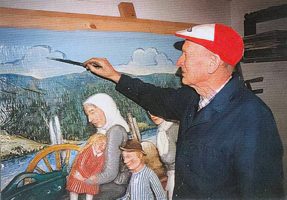 Per Einbu painting the relief