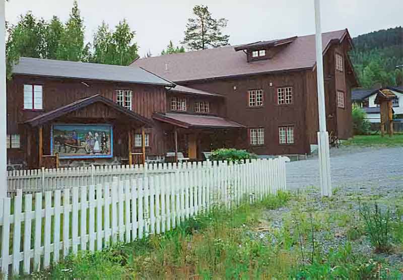 The Land Museum with the Norwegian Emigrant Relief mounted on exterior wall under a protective overhang