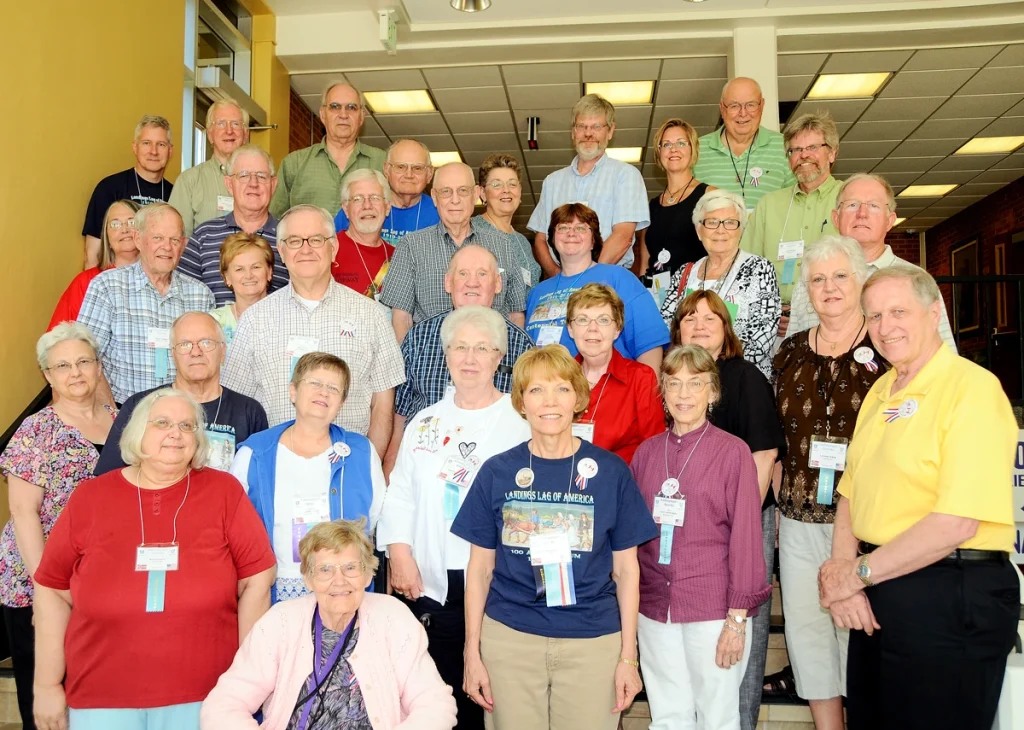 Colored photo from July 16, 2010 of 32 people posing on steps for a picture.